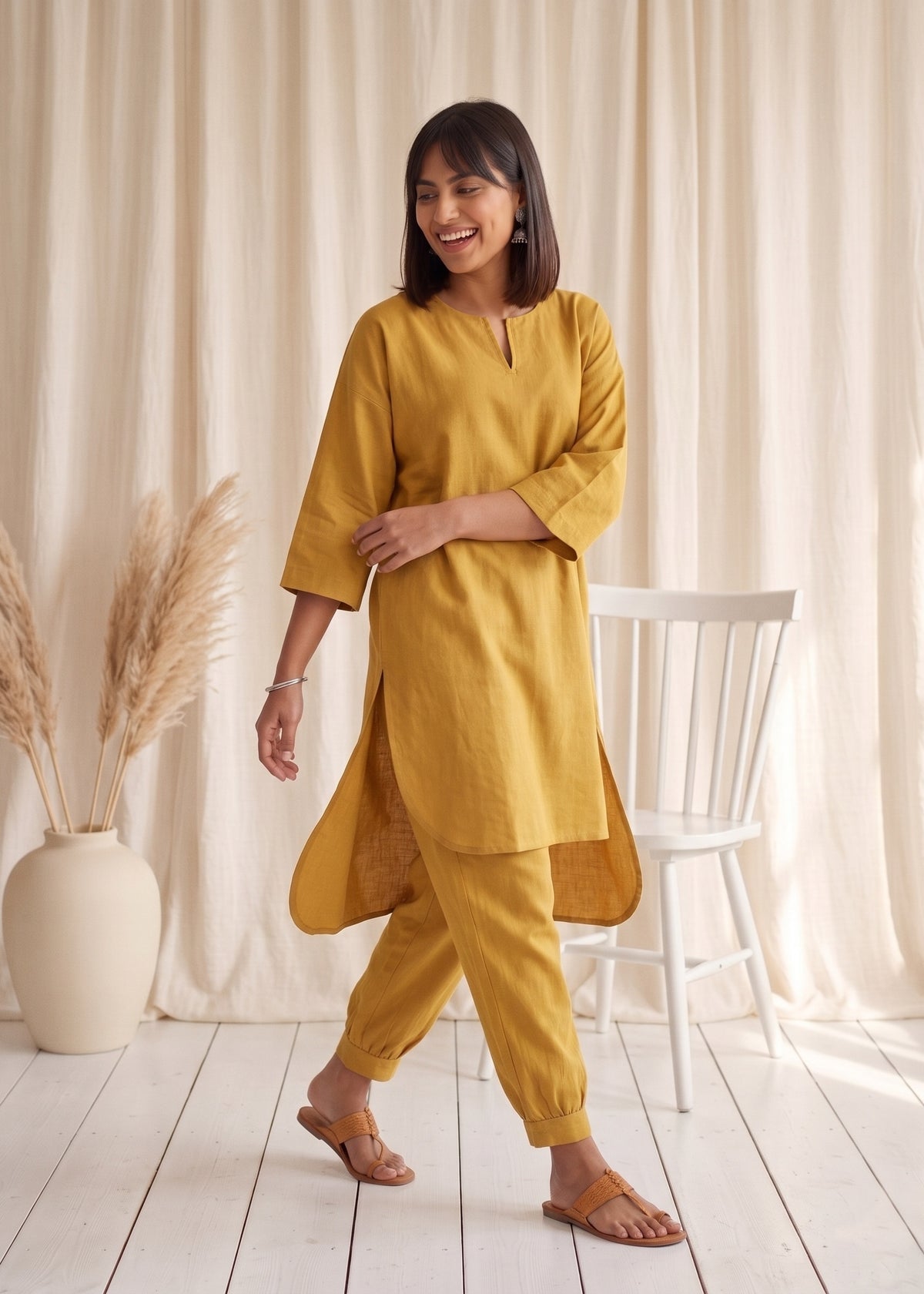 Drift Kurta Co-ord Set in Mustard by Jamies, walking with side slit open