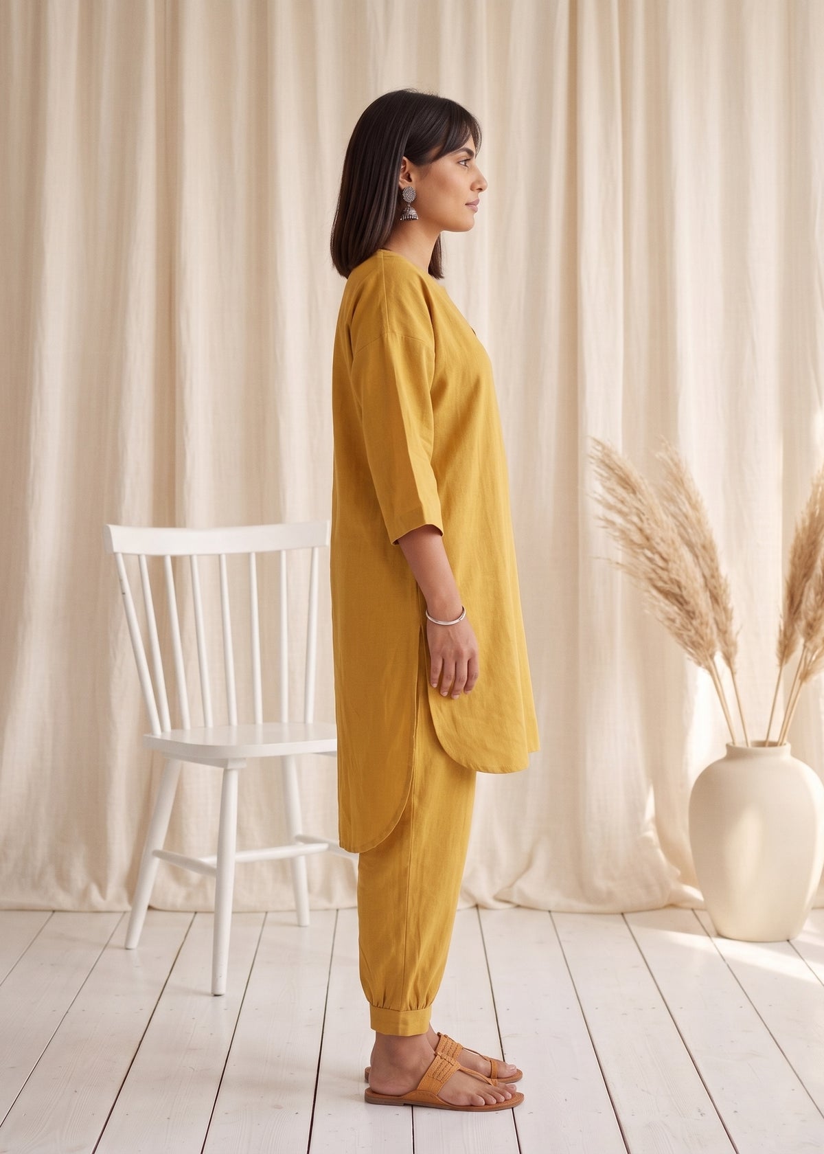 Drift Kurta Co-ord Set in Mustard by Jamies, side profile showing the high-low curved hem