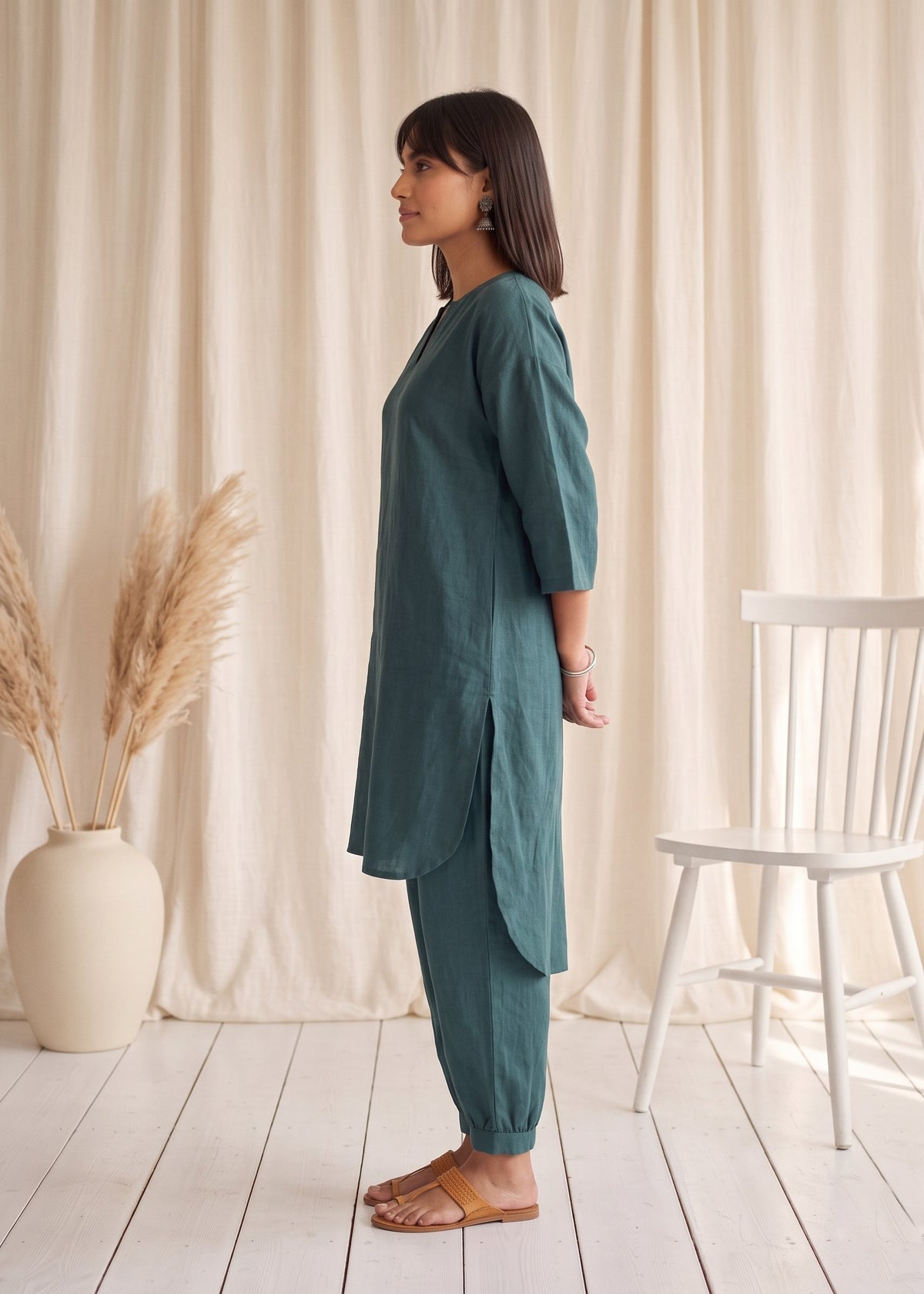 Drift Kurta Co-ord Set in Ocean Green by Jamies, side profile showing the high-low curved hem