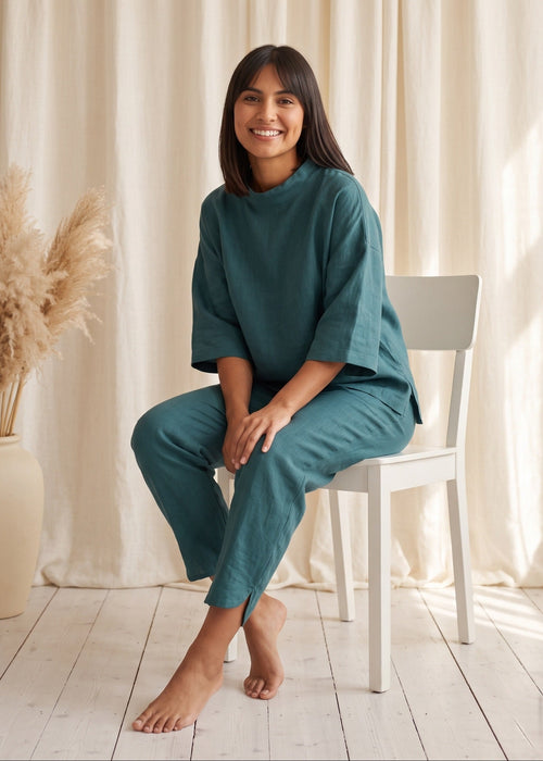 Tide Turn-Around Co-ord Set in Ocean Green by Jamies, seated, top turned around with soft high neck